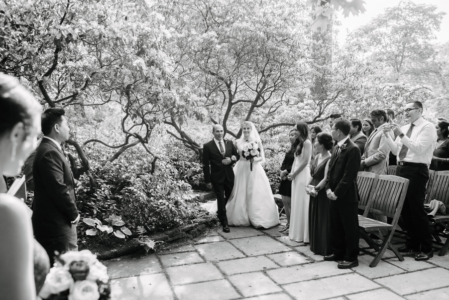 bride and dad walk down the isle