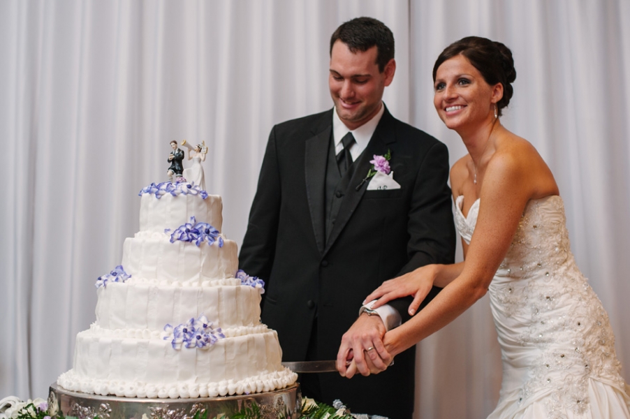 bride and groom cutting the cake