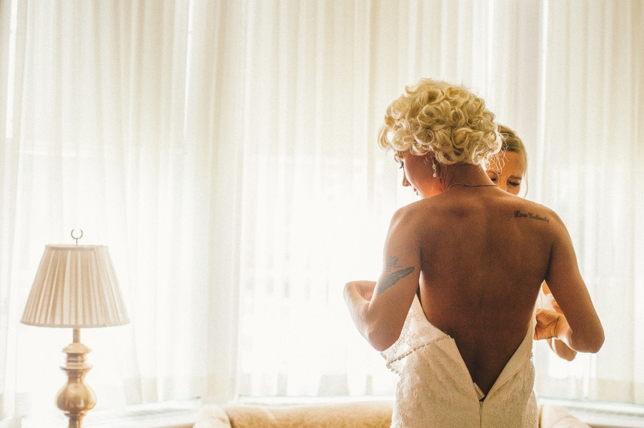 Brides puts on vintage wedding dress